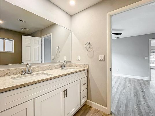 Bathroom, Dual Sink Vanities, Interior, Recessed Lighting, Wood Texture Flooring