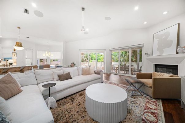 Dining room, Fireplace, Interior, Living room, Pendant Lights, Recessed Lighting, Wood Texture Flooring