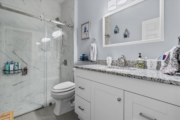 Bathroom, Glass Shower, Interior, Marble Walls, Wood Texture Flooring