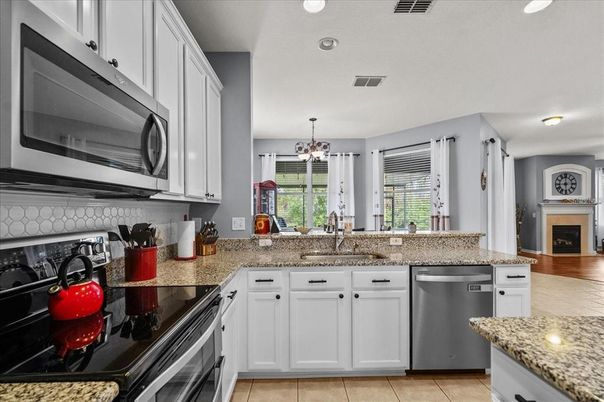 Chandelier, Fireplace, Interior, Kitchen, Recessed Lighting, Stainless Steel Appliances