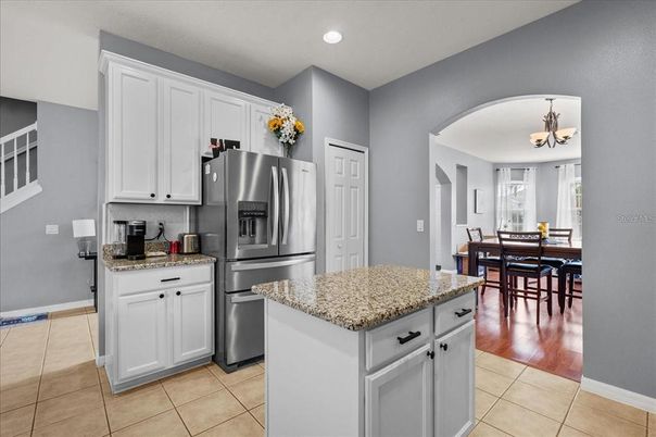 Chandelier, Dining room, Interior, Kitchen, Recessed Lighting, Stainless Steel Appliances, Wood Texture Flooring