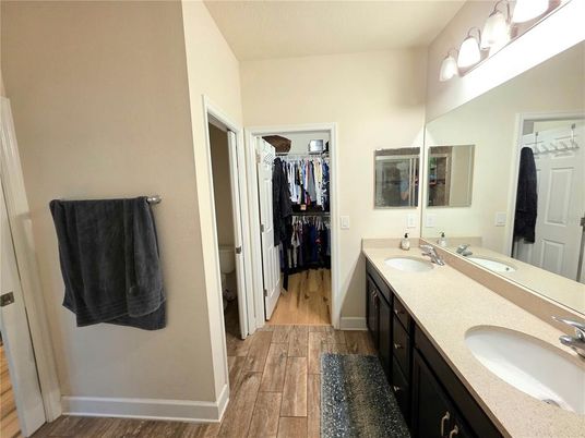 Bathroom, Dual Sink Vanities, Interior, Walk-in Closets, Wood Texture Flooring