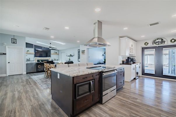 Dining room, Interior, Kitchen, Recessed Lighting, Stainless Steel Appliances, Wood Texture Flooring