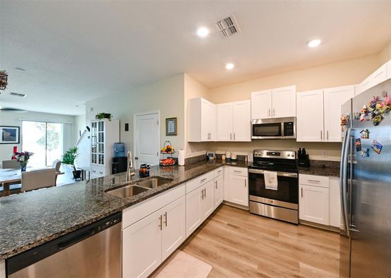 Dining room, Interior, Kitchen, Recessed Lighting, Stainless Steel Appliances, Wood Texture Flooring