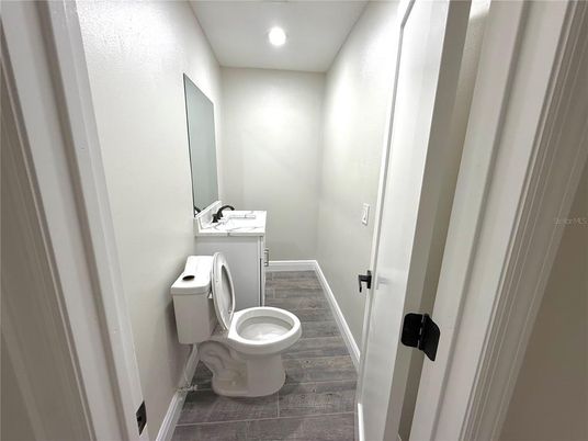 Bathroom, Interior, Recessed Lighting, Washer, Wood Texture Flooring