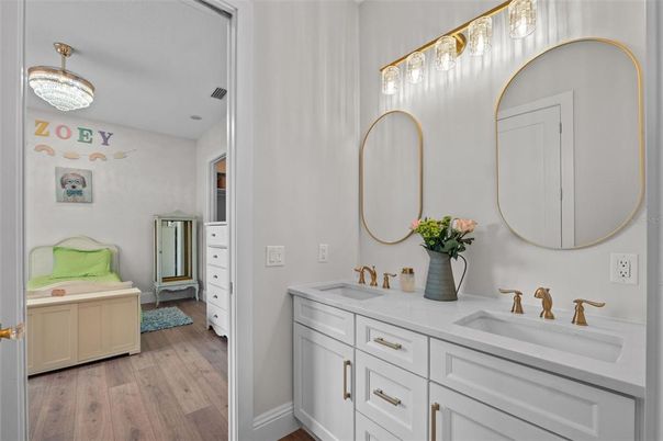 Bathroom, Chandelier, Dual Sink Vanities, Interior, Wood Texture Flooring