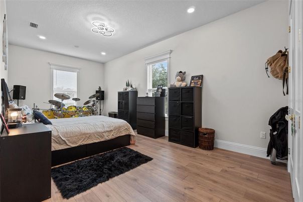 Bedroom, Fitness Equipment, Interior, Recessed Lighting, Wood Texture Flooring