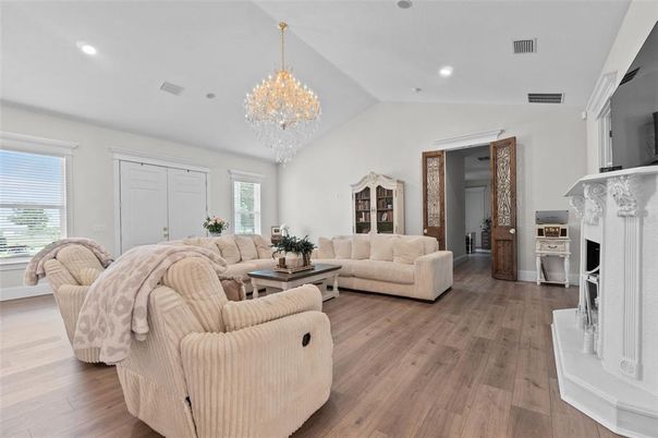 Chandelier, Fireplace, Interior, Living room, Recessed Lighting, Wood Texture Flooring