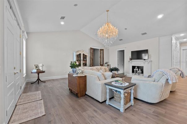 Chandelier, Fireplace, Interior, Living room, Recessed Lighting, Wood Texture Flooring