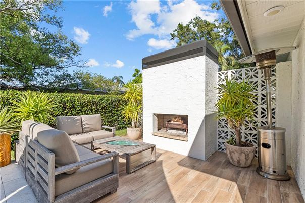 Exterior, Fireplace, Wood Texture Flooring
