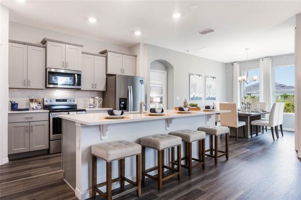 Chandelier, Dining room, Interior, Kitchen, Pendant Lights, Recessed Lighting, Stainless Steel Appliances, Wood Texture Flooring