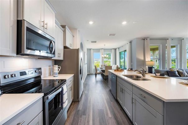 Dining room, Interior, Kitchen, Pendant Lights, Recessed Lighting, Stainless Steel Appliances, Wood Texture Flooring