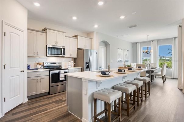 Dining room, Interior, Kitchen, Pendant Lights, Recessed Lighting, Stainless Steel Appliances, Wood Texture Flooring