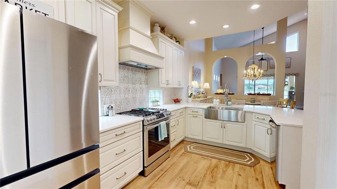 Chandelier, Dining room, Interior, Kitchen, Pendant Lights, Recessed Lighting, Stainless Steel Appliances, Wood Texture Flooring