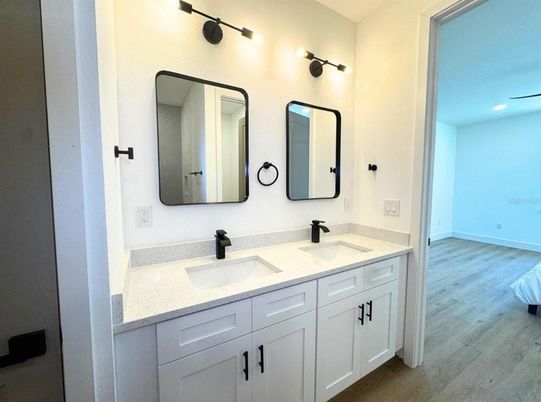 Bathroom, Dual Sink Vanities, Interior, Recessed Lighting, Wood Texture Flooring
