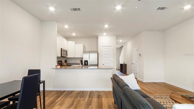 Dining room, Interior, Kitchen, Recessed Lighting, Stainless Steel Appliances, Wood Texture Flooring