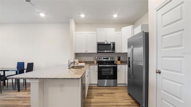 Interior, Kitchen, Recessed Lighting, Stainless Steel Appliances, Wood Texture Flooring
