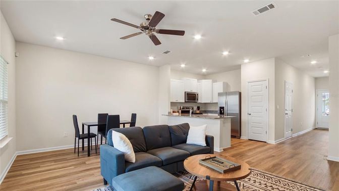 Dining room, Interior, Kitchen, Living room, Recessed Lighting, Stainless Steel Appliances, Wood Texture Flooring