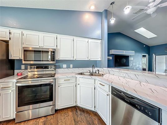 Interior, Kitchen, Recessed Lighting, Stainless Steel Appliances, Wood Texture Flooring