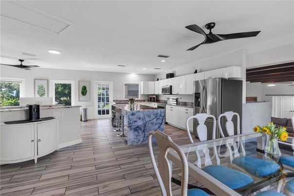 Dining room, Interior, Kitchen, Recessed Lighting, Stainless Steel Appliances, Wood Texture Flooring