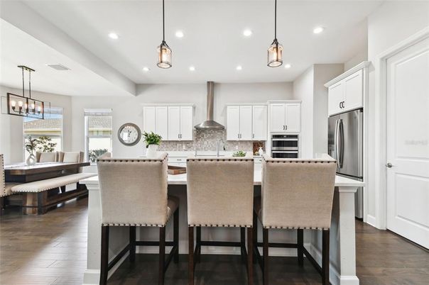 Dining room, Interior, Kitchen, Pendant Lights, Recessed Lighting, Stainless Steel Appliances, Wood Texture Flooring
