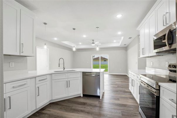Interior, Kitchen, Pendant Lights, Recessed Lighting, Stainless Steel Appliances, Wood Texture Flooring
