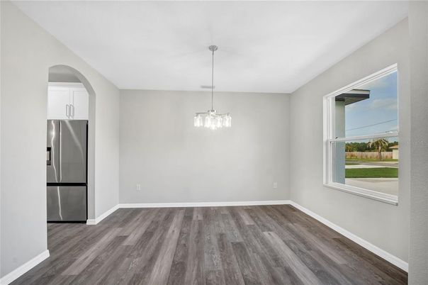 Empty room, Interior, Pendant Lights, Stainless Steel Appliances, Wood Texture Flooring