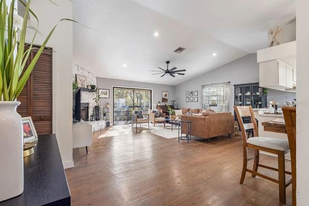 Dining room, Fireplace, Interior, Living room, Recessed Lighting, Wood Texture Flooring