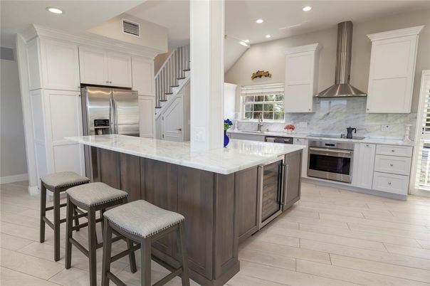 Interior, Kitchen, Marble Walls, Recessed Lighting, Stainless Steel Appliances, Wood Texture Flooring