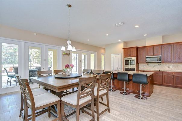 Dining room, Interior, Kitchen, Pendant Lights, Recessed Lighting, Stainless Steel Appliances, Wood Texture Flooring