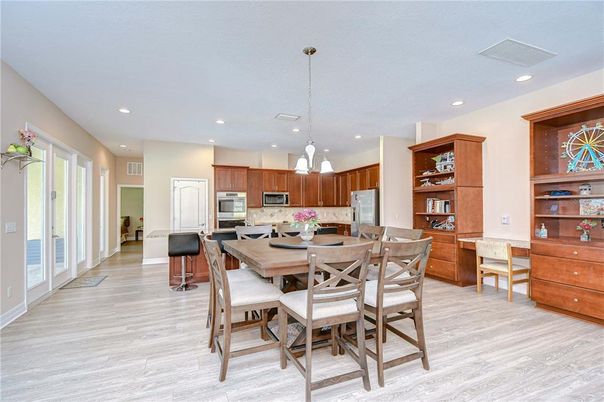 Dining room, Interior, Kitchen, Pendant Lights, Recessed Lighting, Stainless Steel Appliances, Wood Texture Flooring