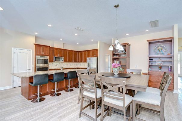 Dining room, Interior, Kitchen, Pendant Lights, Recessed Lighting, Stainless Steel Appliances, Wood Texture Flooring
