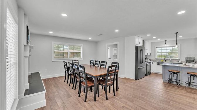 Dining room, Interior, Kitchen, Pendant Lights, Recessed Lighting, Stainless Steel Appliances, Wood Texture Flooring