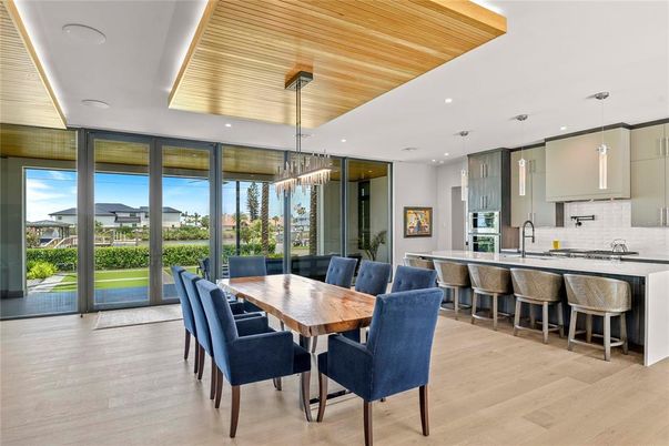 Chandelier, Dining room, Interior, Kitchen, Pendant Lights, Recessed Lighting, Stainless Steel Appliances, Wooden Ceilings, Wood Texture Flooring
