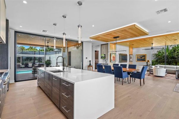 Dining room, Interior, Kitchen, Living room, Pendant Lights, Recessed Lighting, Stainless Steel Appliances, Wooden Ceilings, Wood Texture Flooring