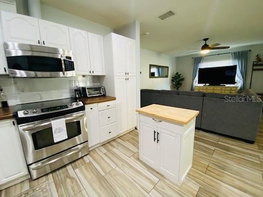 Interior, Kitchen, Living room, Recessed Lighting, Stainless Steel Appliances, Wood Texture Flooring