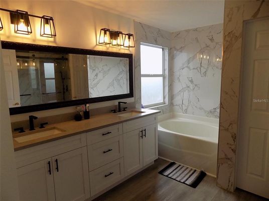 Bathroom, Dual Sink Vanities, Interior, Marble Walls, Wood Texture Flooring