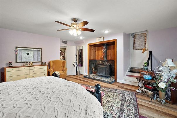 Bedroom, Fireplace, Interior, Recessed Lighting, Wood Texture Flooring