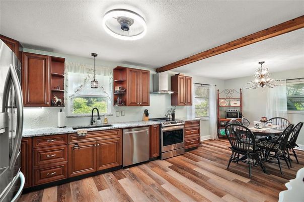 Chandelier, Dining room, Interior, Kitchen, Pendant Lights, Stainless Steel Appliances, Wood Texture Flooring
