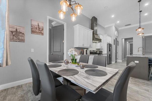 Dining room, Interior, Kitchen, Pendant Lights, Recessed Lighting, Stainless Steel Appliances, Wood Texture Flooring