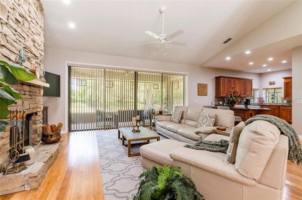 Fireplace, Interior, Kitchen, Living room, Recessed Lighting, Stone Walls, Wood Texture Flooring