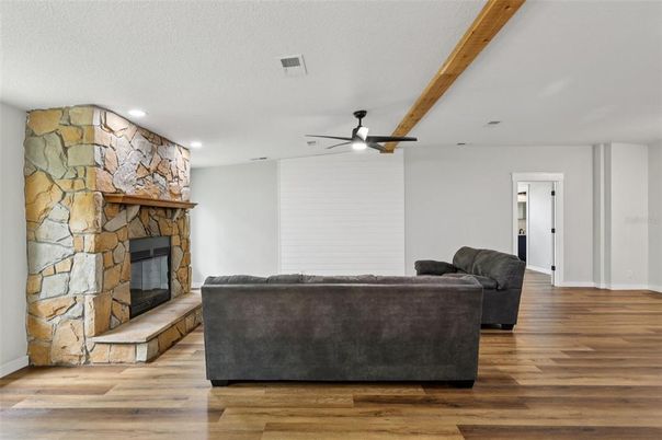 Fireplace, Interior, Living room, Recessed Lighting, Stone Walls, Wooden Beams, Wood Texture Flooring
