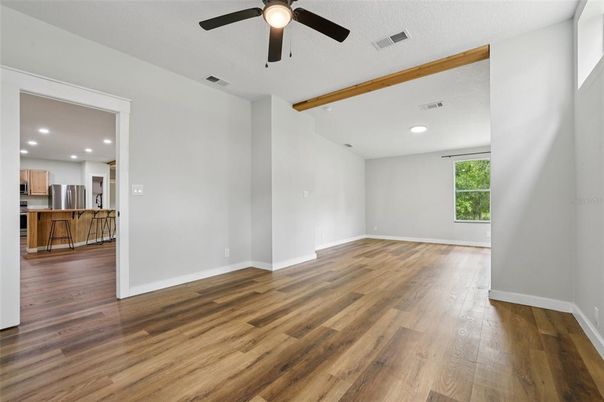 Empty room, Interior, Kitchen, Recessed Lighting, Stainless Steel Appliances, Wooden Beams, Wood Texture Flooring
