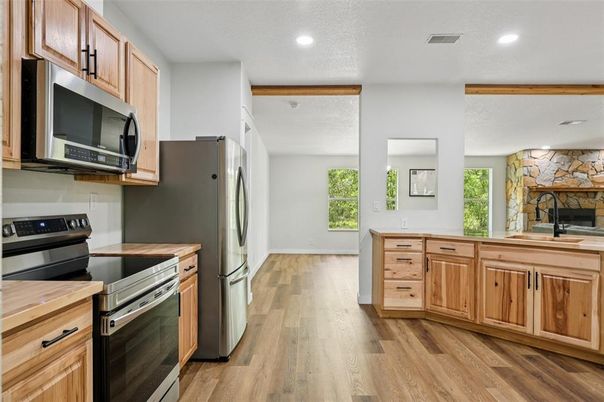 Fireplace, Interior, Kitchen, Recessed Lighting, Stone Walls, Wood Texture Flooring