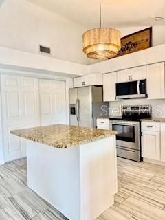 Chandelier, Interior, Kitchen, Pendant Lights, Stainless Steel Appliances, Wood Texture Flooring