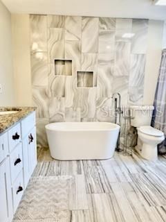 Bathroom, Free Standing Baths, Interior, Marble Walls, Wood Texture Flooring