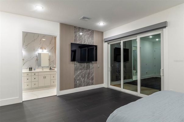 Bathroom, Bedroom, Glass Shower, Interior, Marble, Marble Walls, Recessed Lighting, Wood Texture Flooring