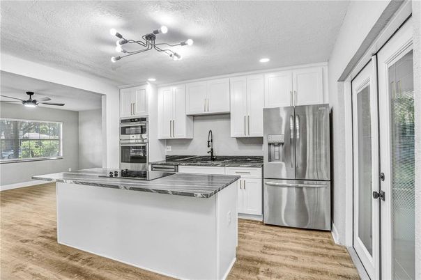 Interior, Kitchen, Recessed Lighting, Stainless Steel Appliances, Wood Texture Flooring