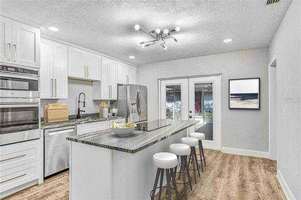 Interior, Kitchen, Recessed Lighting, Stainless Steel Appliances, Wood Texture Flooring