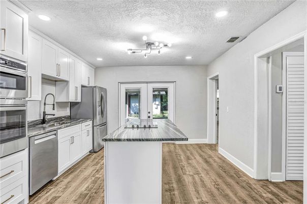 Interior, Kitchen, Recessed Lighting, Stainless Steel Appliances, Wood Texture Flooring